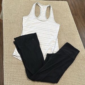 Elegant tank top and black athletic leggings. Ideal for fitness or casual outing